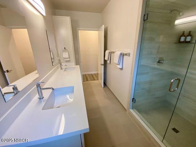 0 Old Mission Drive Solvang, CA 93463 - Photo 48 of 68 a bathroom with a tub a sink and glass door shower