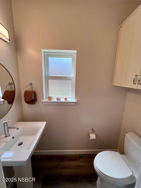 0 Old Mission Drive Solvang, CA 93463 - Photo 53 of 68 a bathroom with a toilet a sink and mirror