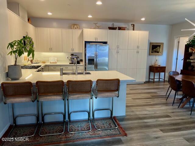 0 Old Mission Drive Solvang, CA 93463 - Photo 7 of 68 a kitchen with stainless steel appliances kitchen island granite countertop a table and chairs in it