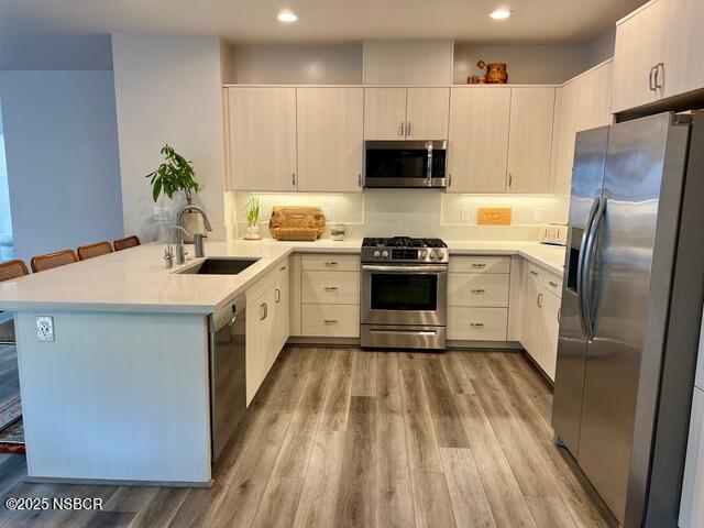 0 Old Mission Drive Solvang, CA 93463 - Photo 8 of 68 a kitchen with stainless steel appliances white cabinets a sink a stove a refrigerator and a microwave