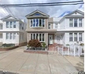 a front view of a building with many windows