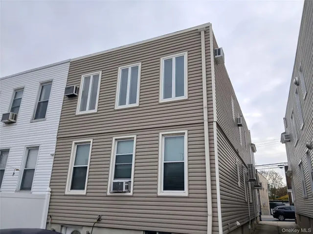 a front view of a house with many windows