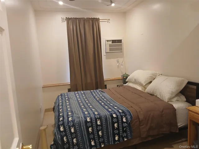 a bedroom with a bed and a closet