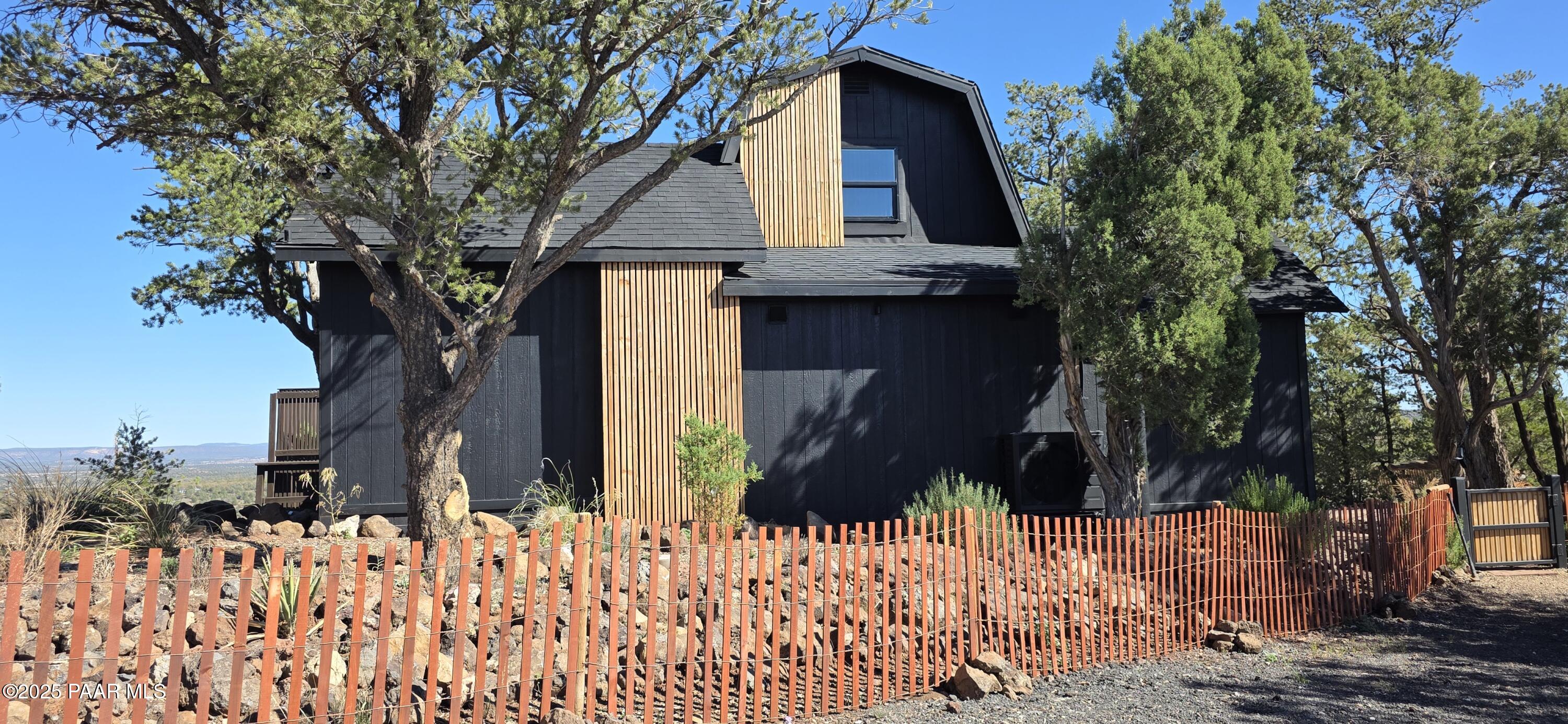 8200 West Rolling Ridge Road Ash Fork, AZ 86320 - Photo 2 of 38 a front view of a house with a yard