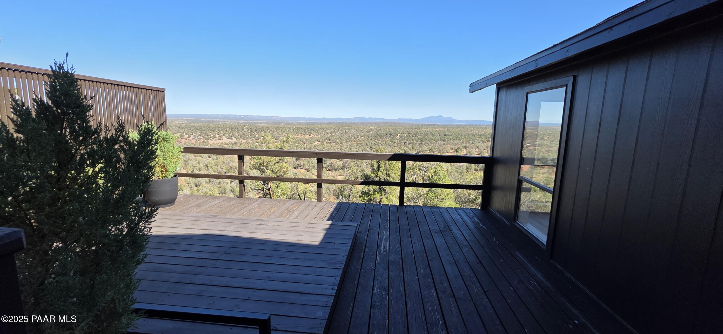 8200 West Rolling Ridge Road Ash Fork, AZ 86320 - Photo 33 of 38 a view of balcony with wooden floor and fence