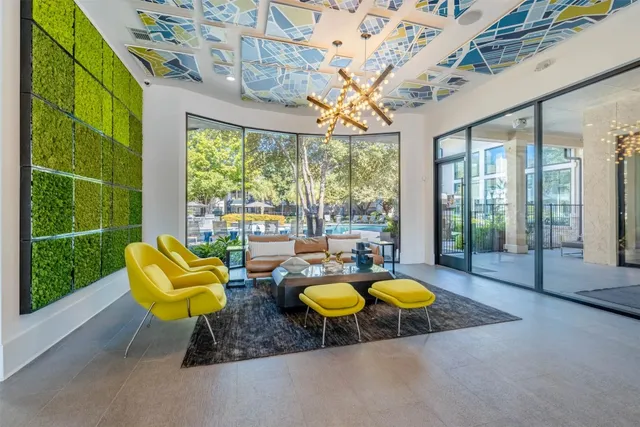 a bathroom with a granite countertop sink toilet mirror and a bathtub