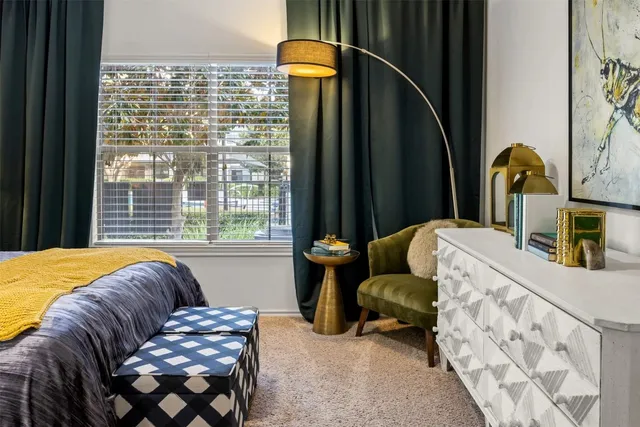 a bed room with a bed and a chandelier