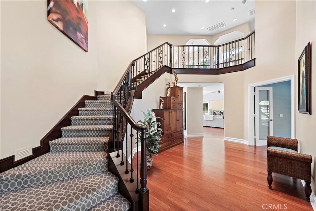 4 Via Goleta San Clemente, CA 92673 - Photo 12 of 70 a view of staircase with lots of frames on wall and a wooden floor