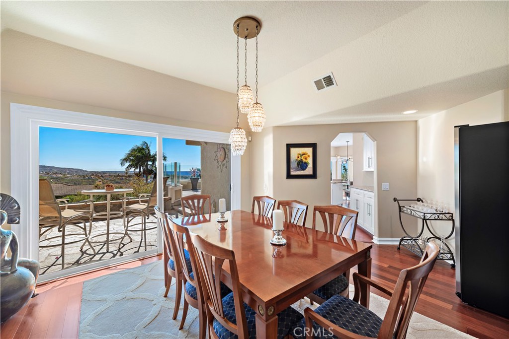 4 Via Goleta San Clemente, CA 92673 - Photo 14 of 70 a dining room with furniture a chandelier and wooden floor