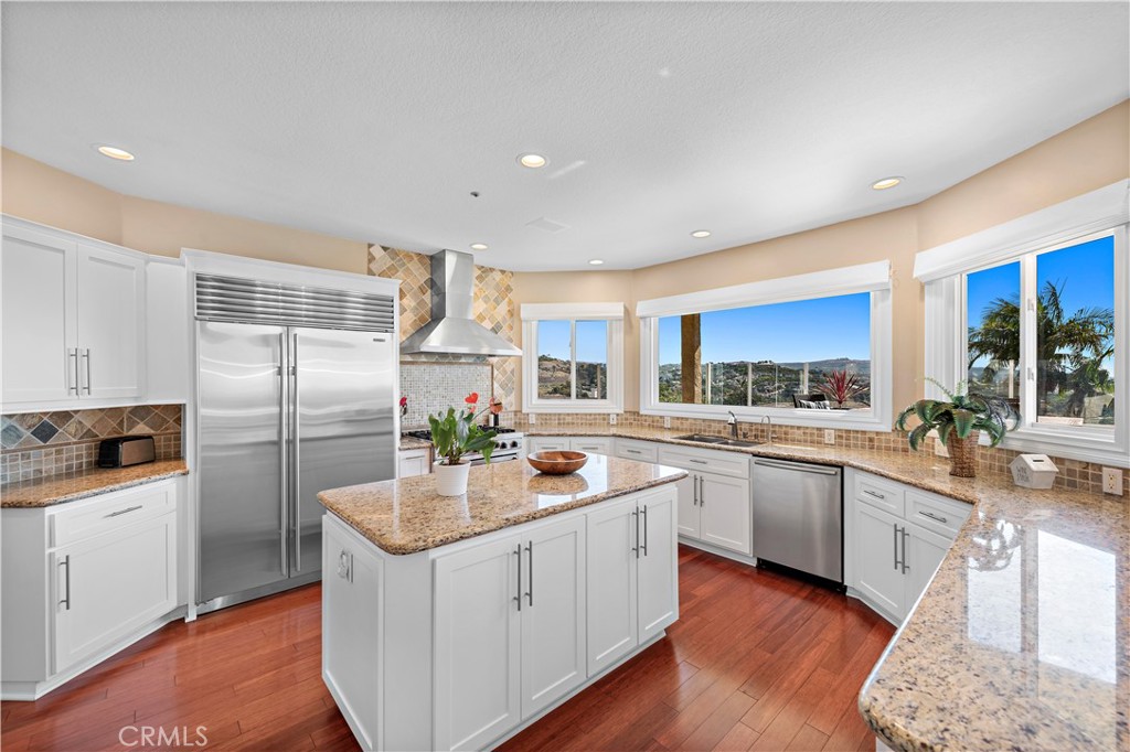 4 Via Goleta San Clemente, CA 92673 - Photo 15 of 70 a kitchen with a sink stove cabinets and refrigerator