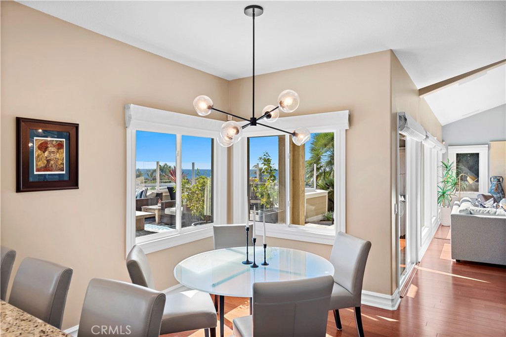 4 Via Goleta San Clemente, CA 92673 - Photo 19 of 70 a dining room with furniture a chandelier and wooden floor