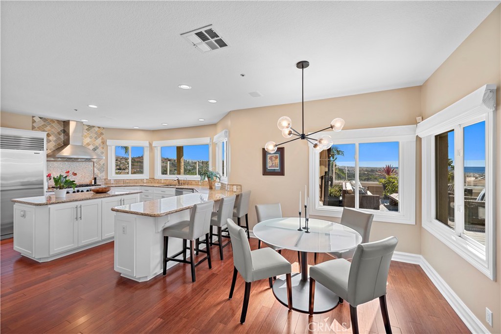 4 Via Goleta San Clemente, CA 92673 - Photo 20 of 70 a kitchen that has a table and chairs in it