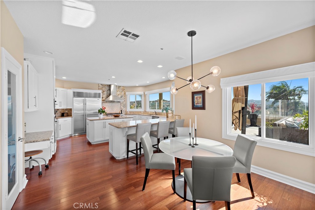 4 Via Goleta San Clemente, CA 92673 - Photo 22 of 70 a view of a dining room with furniture window and wooden floor