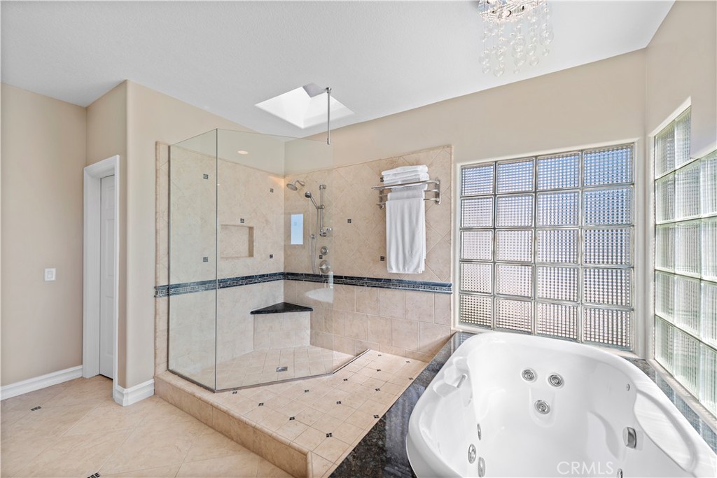 4 Via Goleta San Clemente, CA 92673 - Photo 32 of 70 a bathroom with a bathtub and a shower