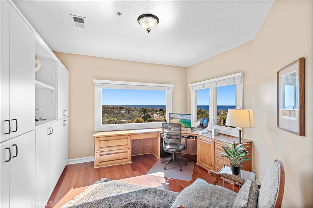 4 Via Goleta San Clemente, CA 92673 - Photo 37 of 70 a living room with furniture a fireplace and a flat screen tv