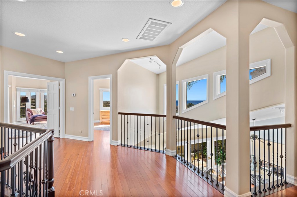 4 Via Goleta San Clemente, CA 92673 - Photo 42 of 70 a view of a hallway with wooden floor and windows