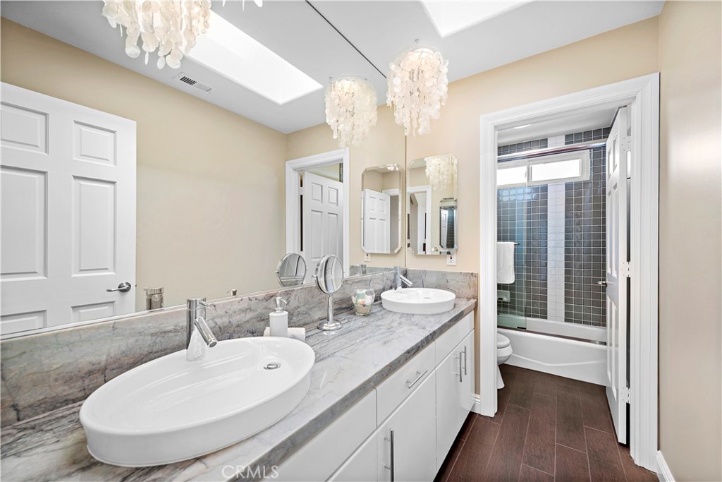 4 Via Goleta San Clemente, CA 92673 - Photo 44 of 70 a bathroom with a double vanity sink and a mirror
