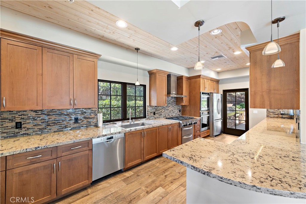 4 Via Goleta San Clemente, CA 92673 - Photo 64 of 70 a large kitchen with kitchen island a large counter space a sink a window and stainless steel appliances