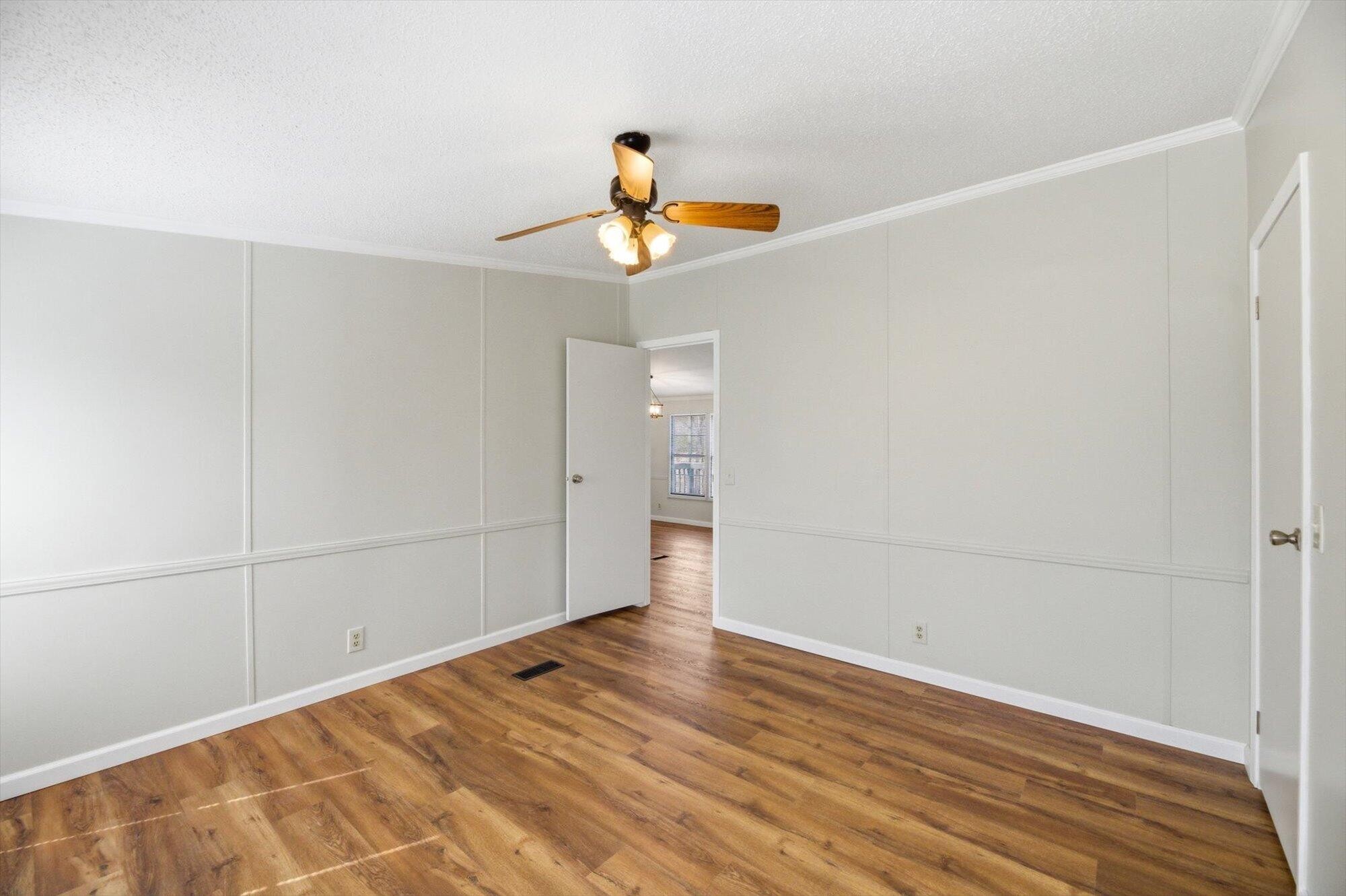 64 County Road 100 Decatur, TN 37322 - Photo 12 of 43 a view of an empty room with wooden floor
