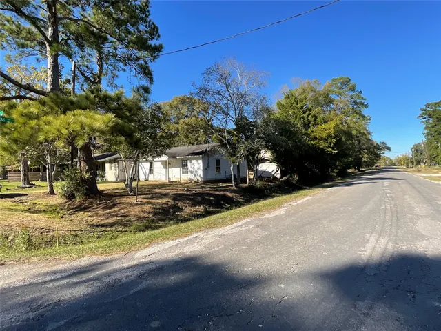 a view of a road with a building in the background