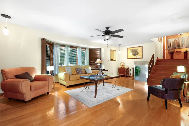 a living room with furniture or couch and a wooden floor
