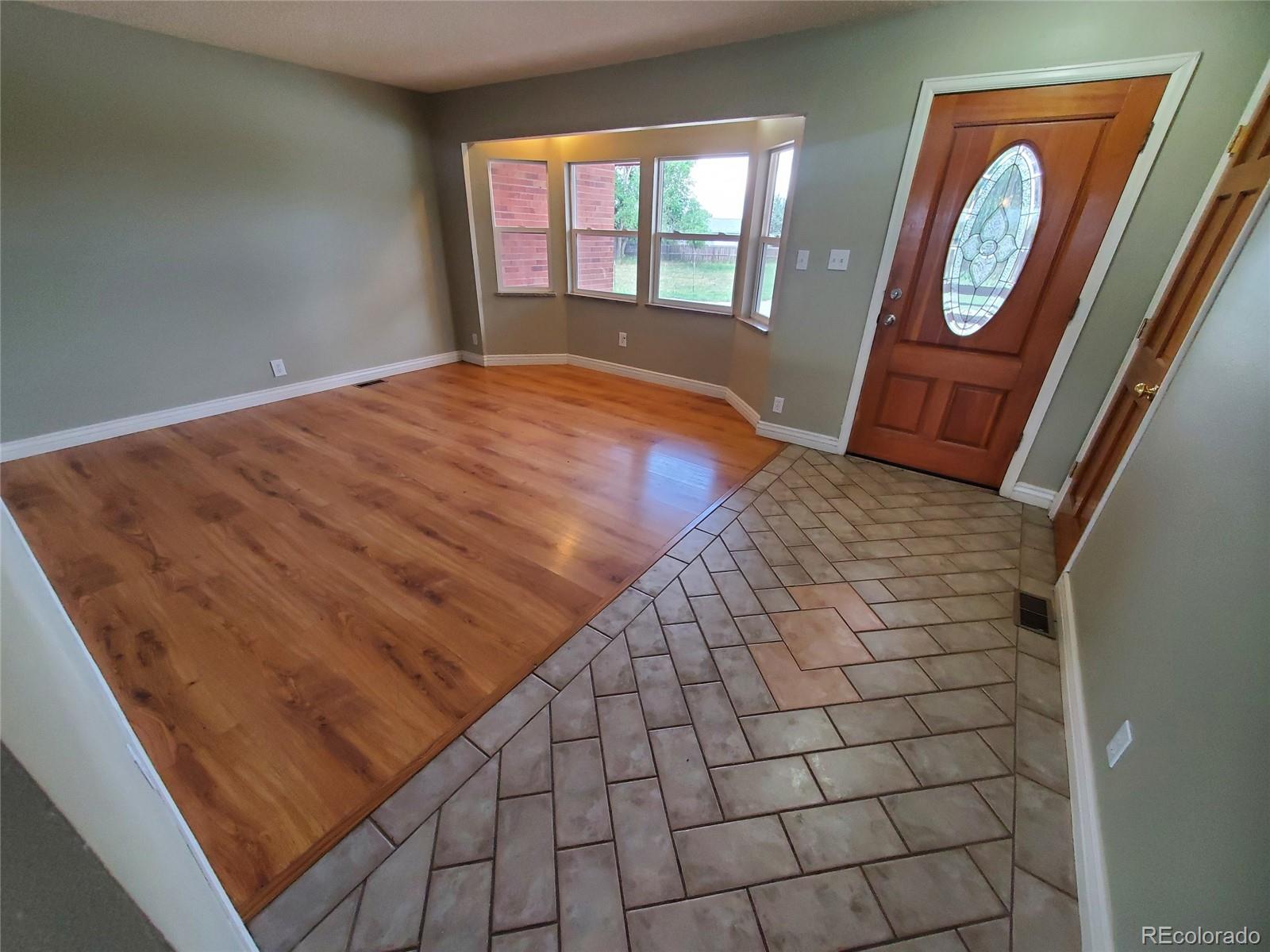 Undisclosed Address Broomfield, CO 80023 - Photo 11 of 25 a view of an empty room and wooden floor