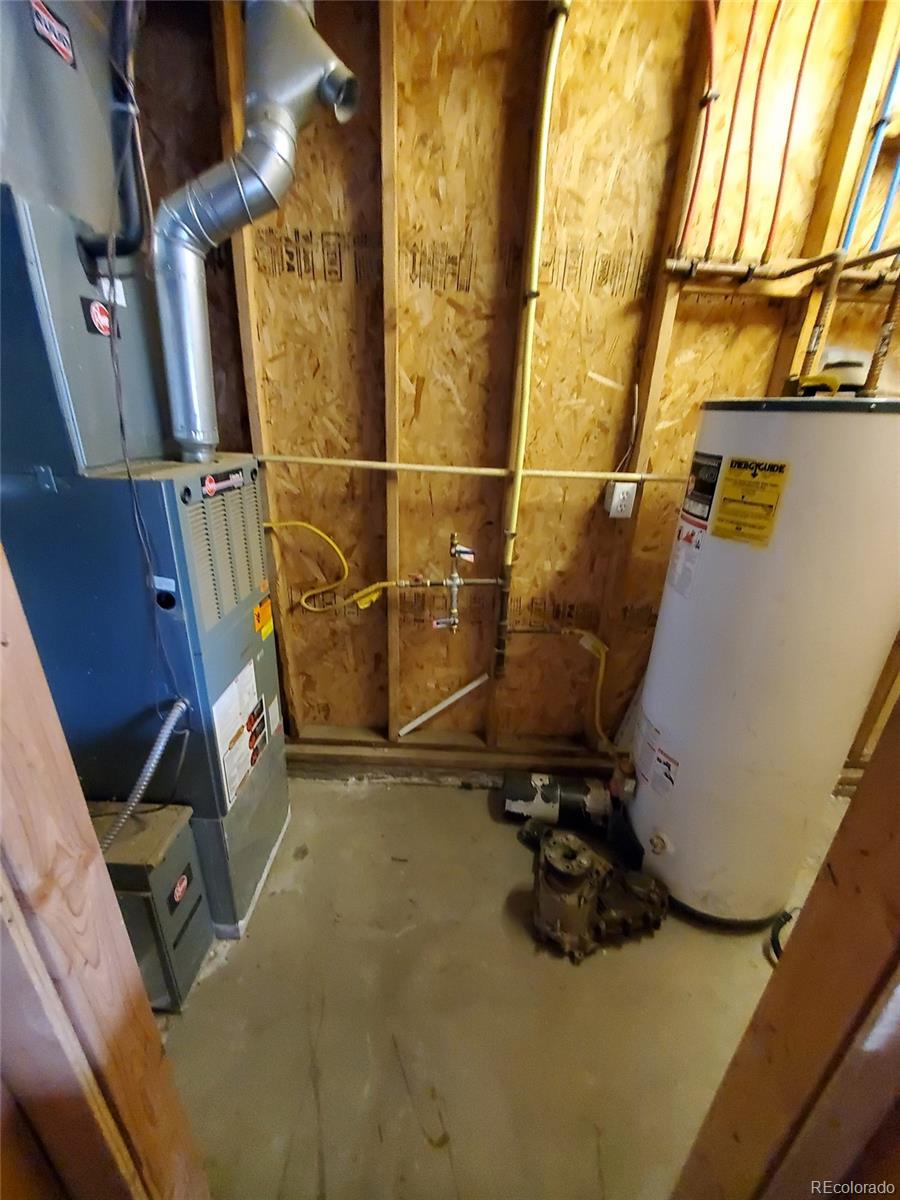 Undisclosed Address Broomfield, CO 80023 - Photo 14 of 25 a view of walk in closet with clothes and shoes
