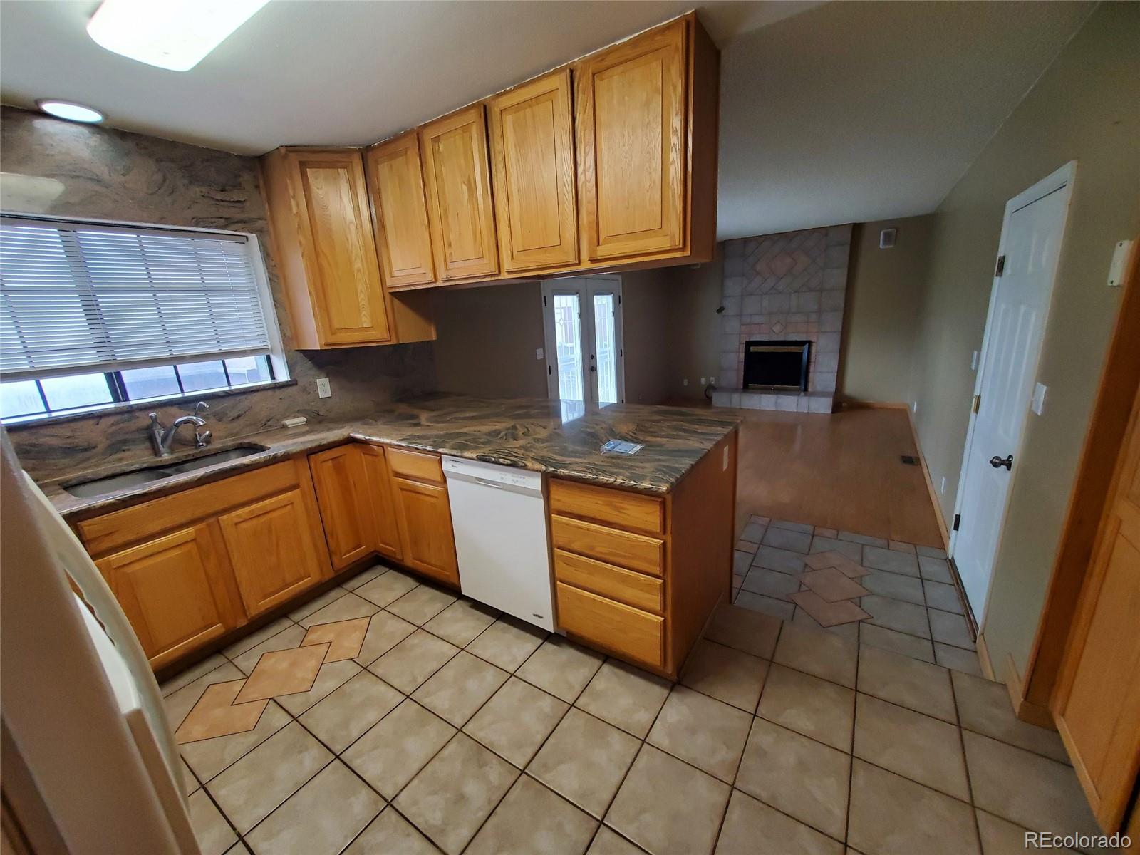 Undisclosed Address Broomfield, CO 80023 - Photo 16 of 25 a kitchen with stainless steel appliances granite countertop a stove a sink and a microwave
