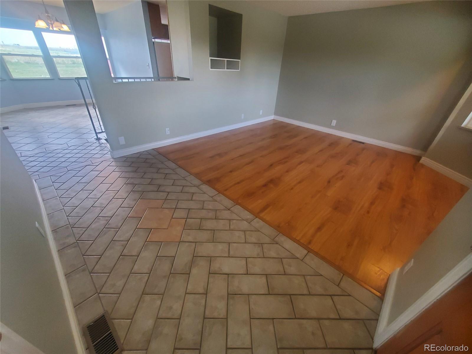 Undisclosed Address Broomfield, CO 80023 - Photo 18 of 25 a view of empty room with wooden floor