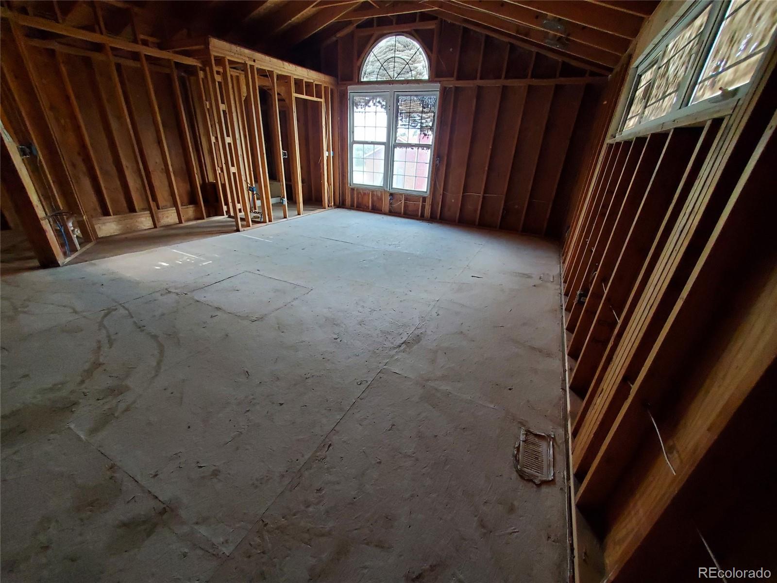 Undisclosed Address Broomfield, CO 80023 - Photo 21 of 25 a view of an empty room with wooden floor and a window