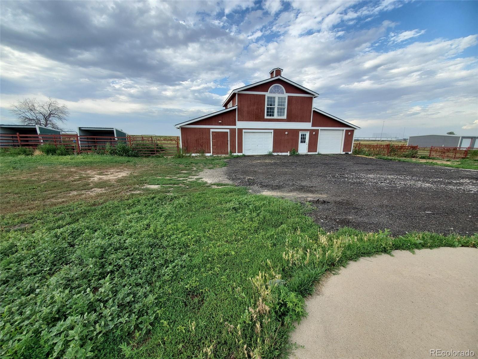 Undisclosed Address Broomfield, CO 80023 - Photo 25 of 25 a front of a house with a yard