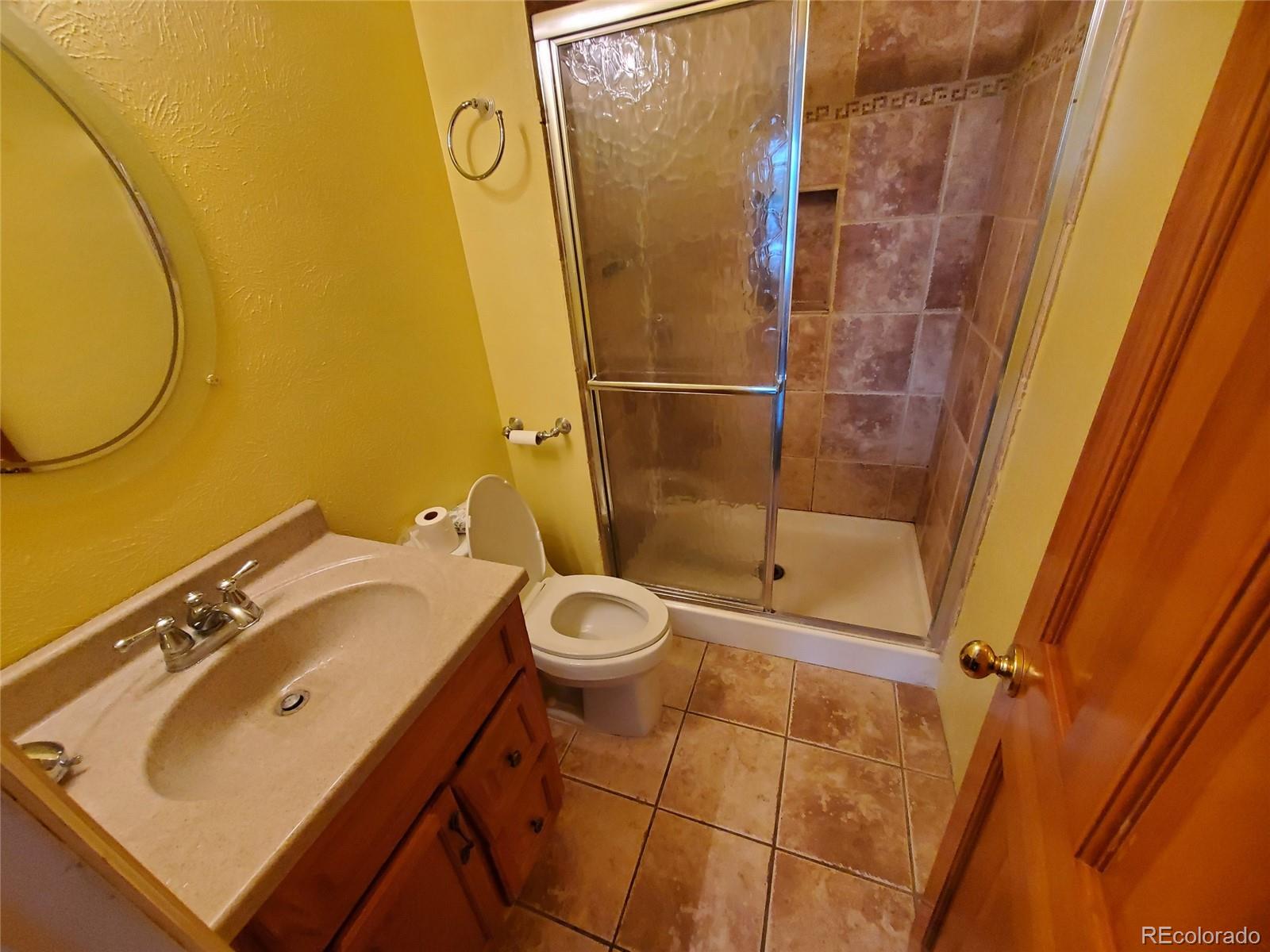 Undisclosed Address Broomfield, CO 80023 - Photo 5 of 25 a bathroom with a sink and a mirror