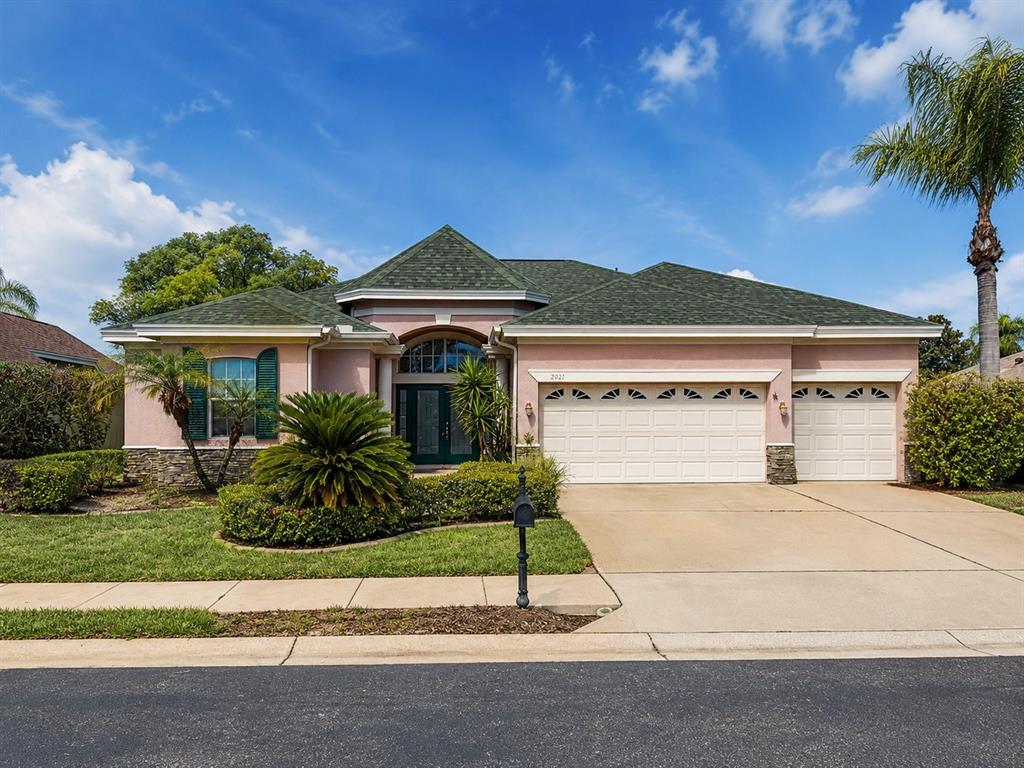 2021 Blue Beech Court Trinity, FL 34655 - Photo 1 of 2 a front view of a house with a yard and garage