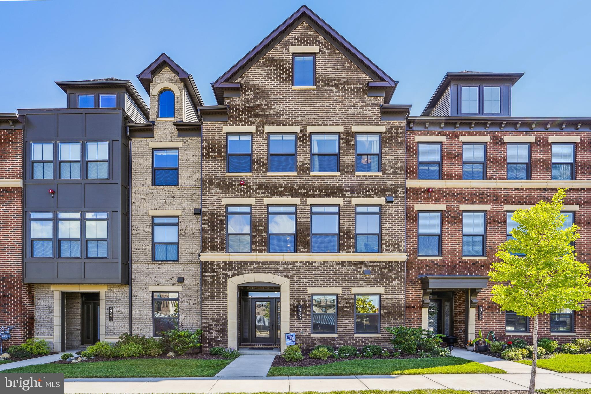 43469 Grandmoore Street Ashburn, VA 20148 - Photo 1 of 62 a front view of a multi story building