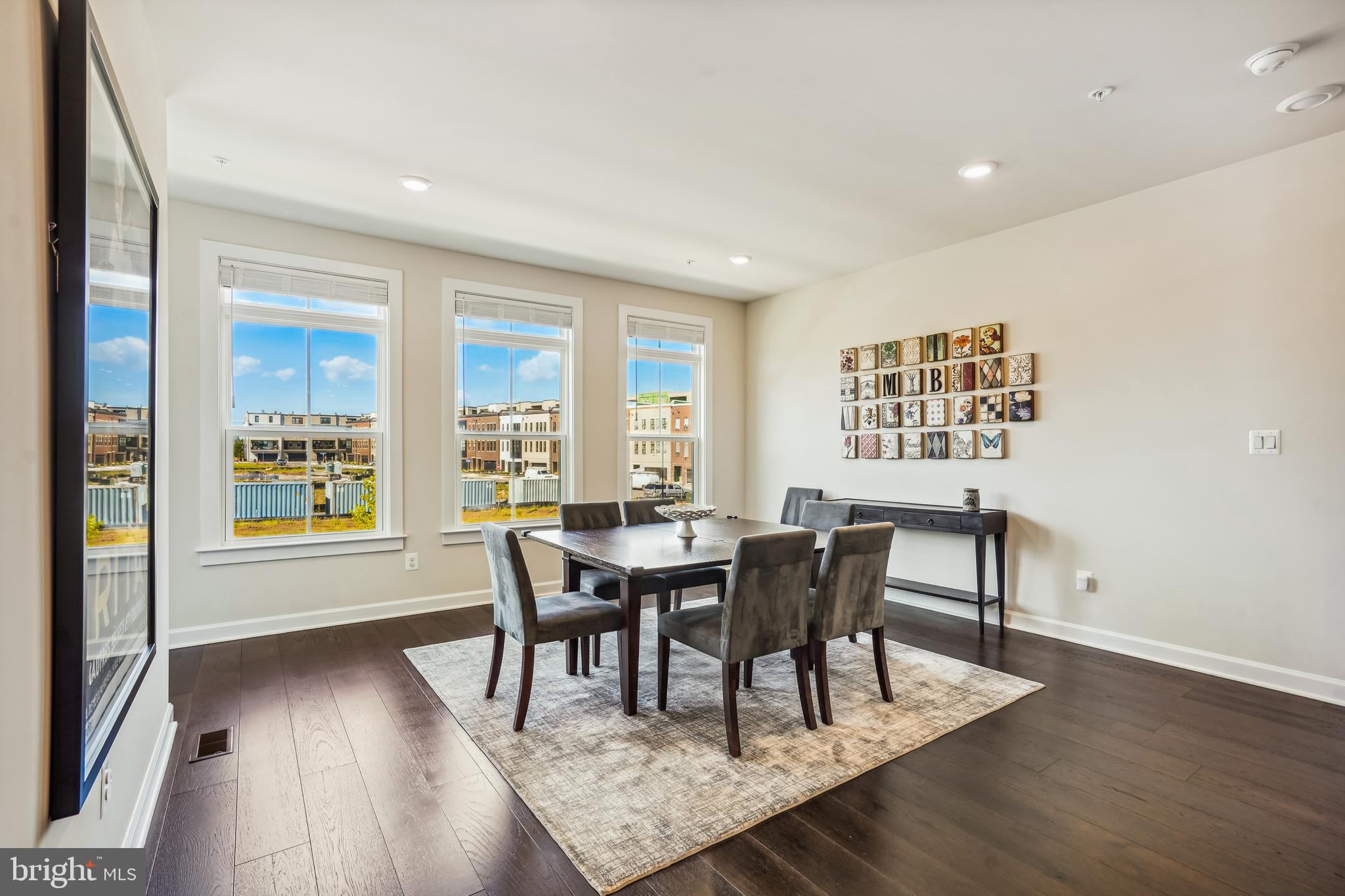 43469 Grandmoore Street Ashburn, VA 20148 - Photo 12 of 62 a view of a dining room with furniture and wooden floor