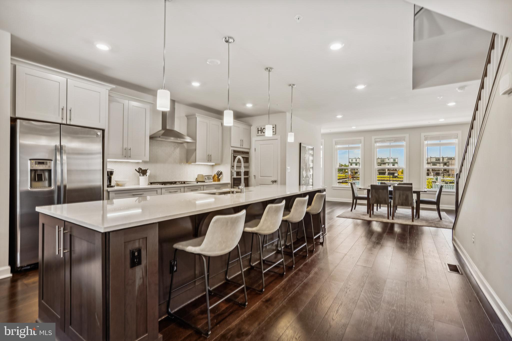 43469 Grandmoore Street Ashburn, VA 20148 - Photo 62 of 62 a kitchen with counter space dining table and chairs