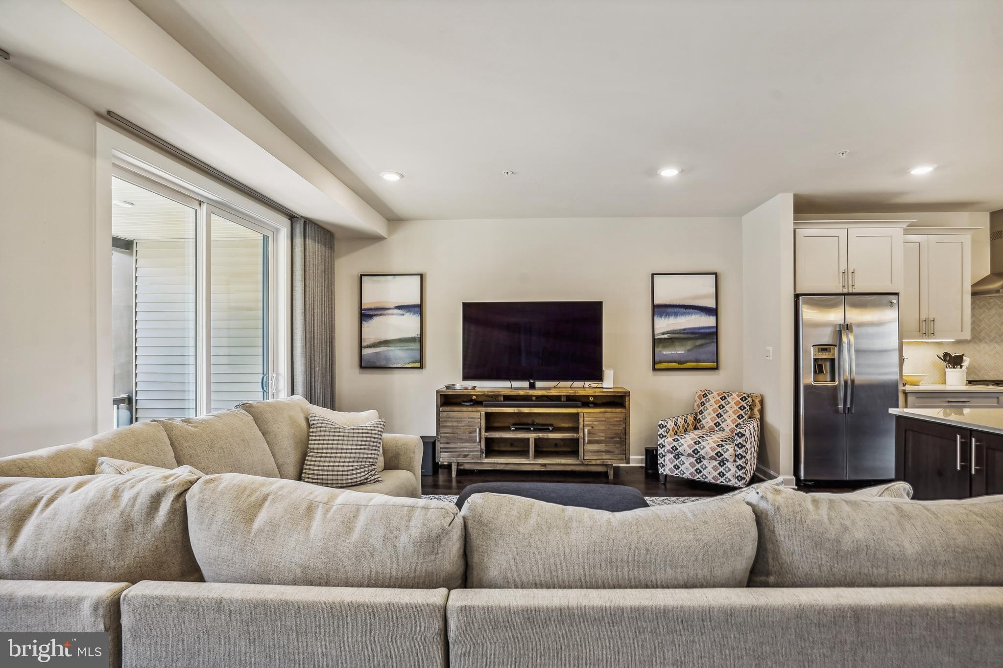 43469 Grandmoore Street Ashburn, VA 20148 - Photo 20 of 62 a living room with furniture and a flat screen tv