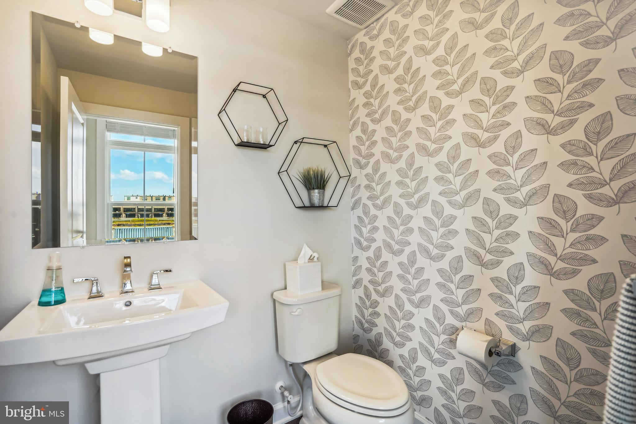 43469 Grandmoore Street Ashburn, VA 20148 - Photo 24 of 62 a bathroom with a toilet sink and mirror