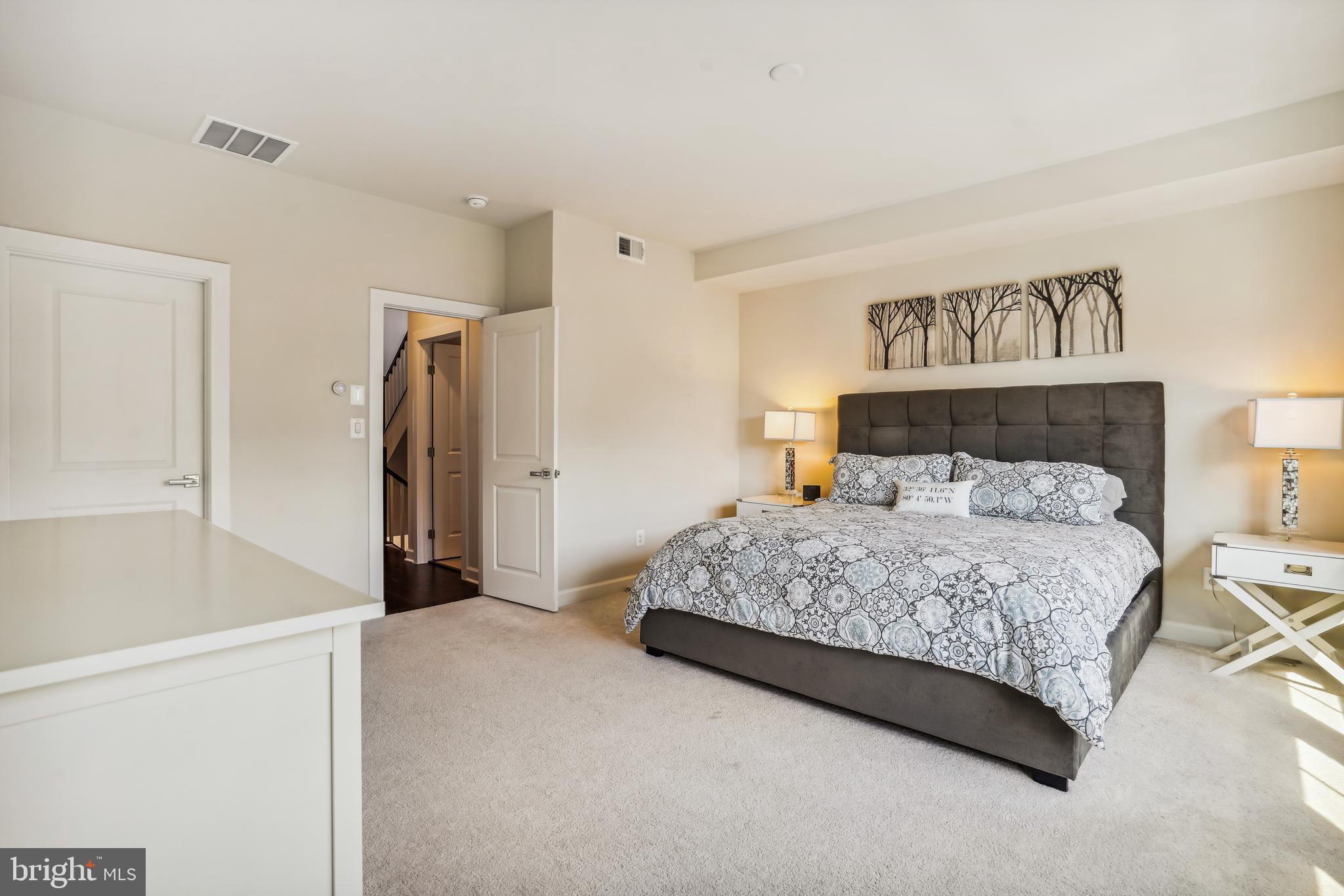 43469 Grandmoore Street Ashburn, VA 20148 - Photo 26 of 62 a bedroom with a bed and a refrigerator