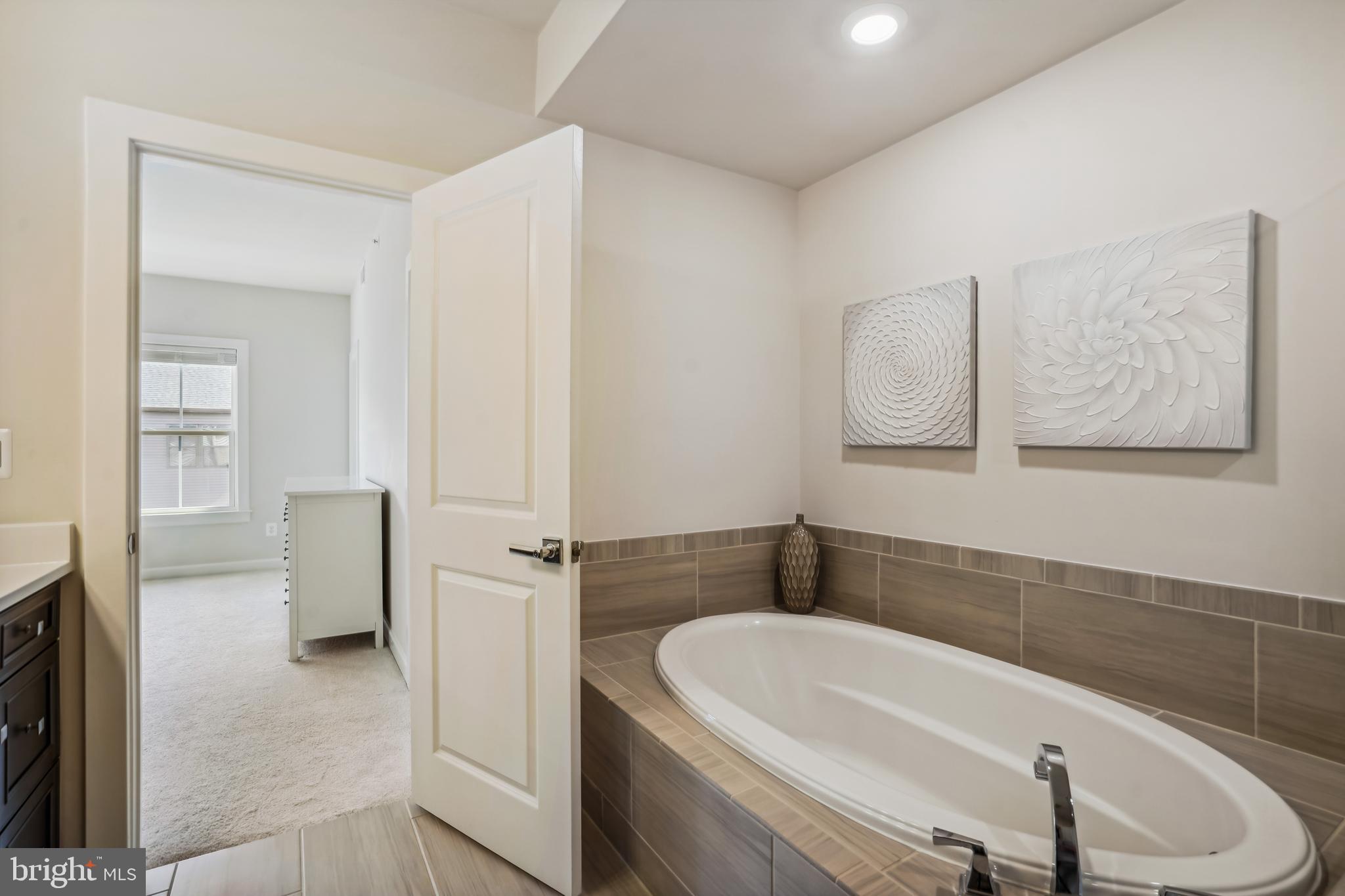 43469 Grandmoore Street Ashburn, VA 20148 - Photo 29 of 62 a bathroom with a bathtub sink and toilet