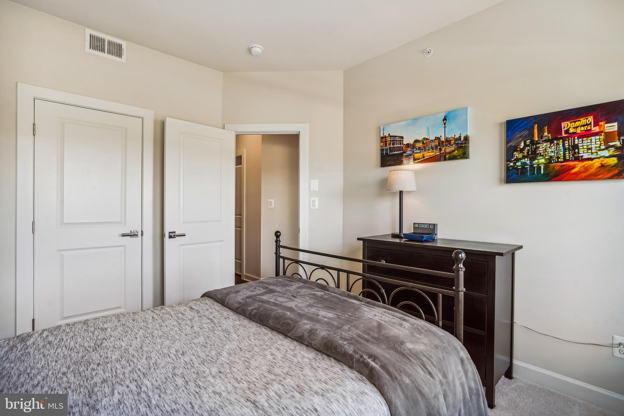 43469 Grandmoore Street Ashburn, VA 20148 - Photo 32 of 62 a bedroom with a bed and a flat screen tv