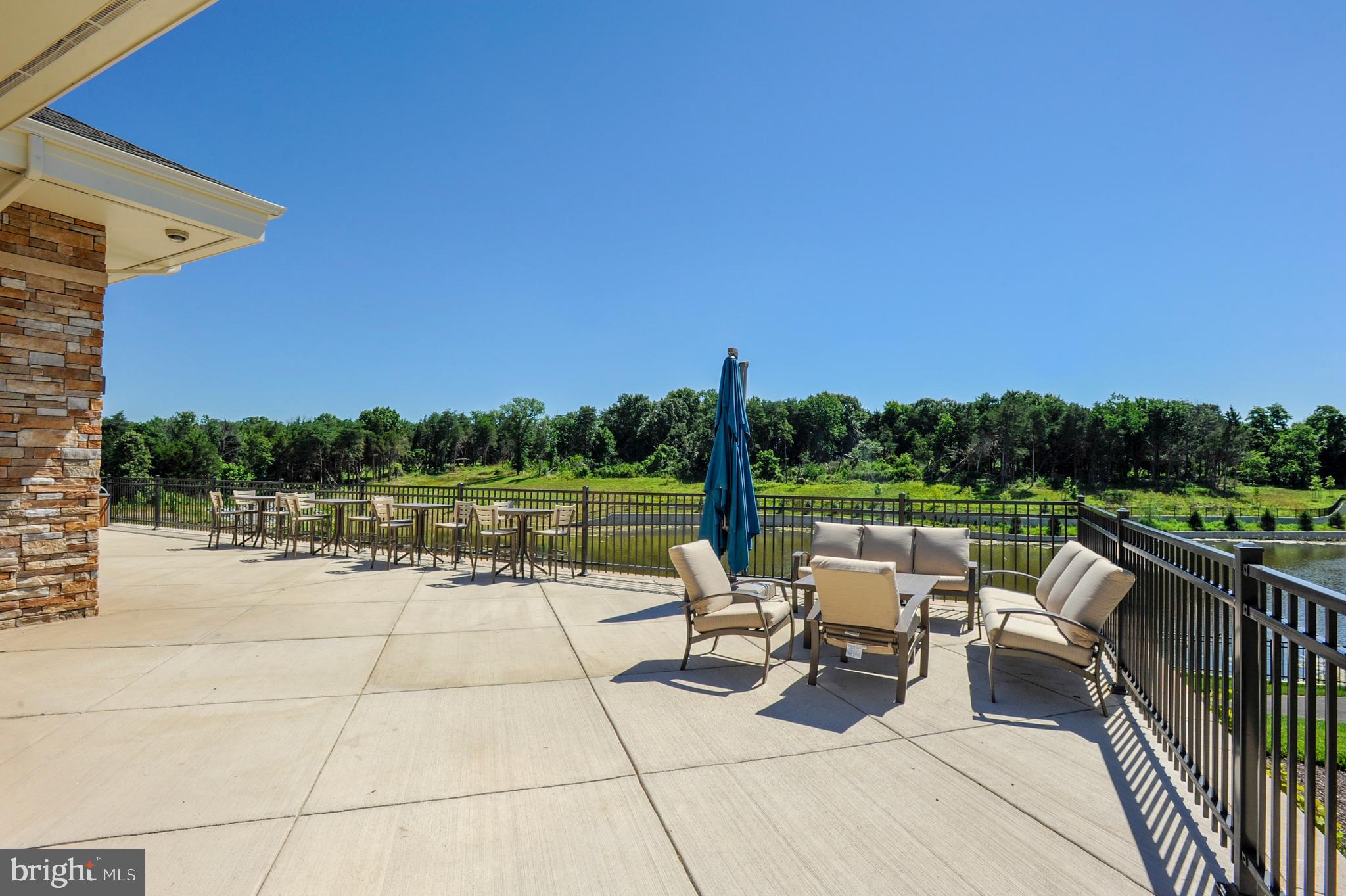 43469 Grandmoore Street Ashburn, VA 20148 - Photo 48 of 62 a view of swimming pool with seating area and lake view