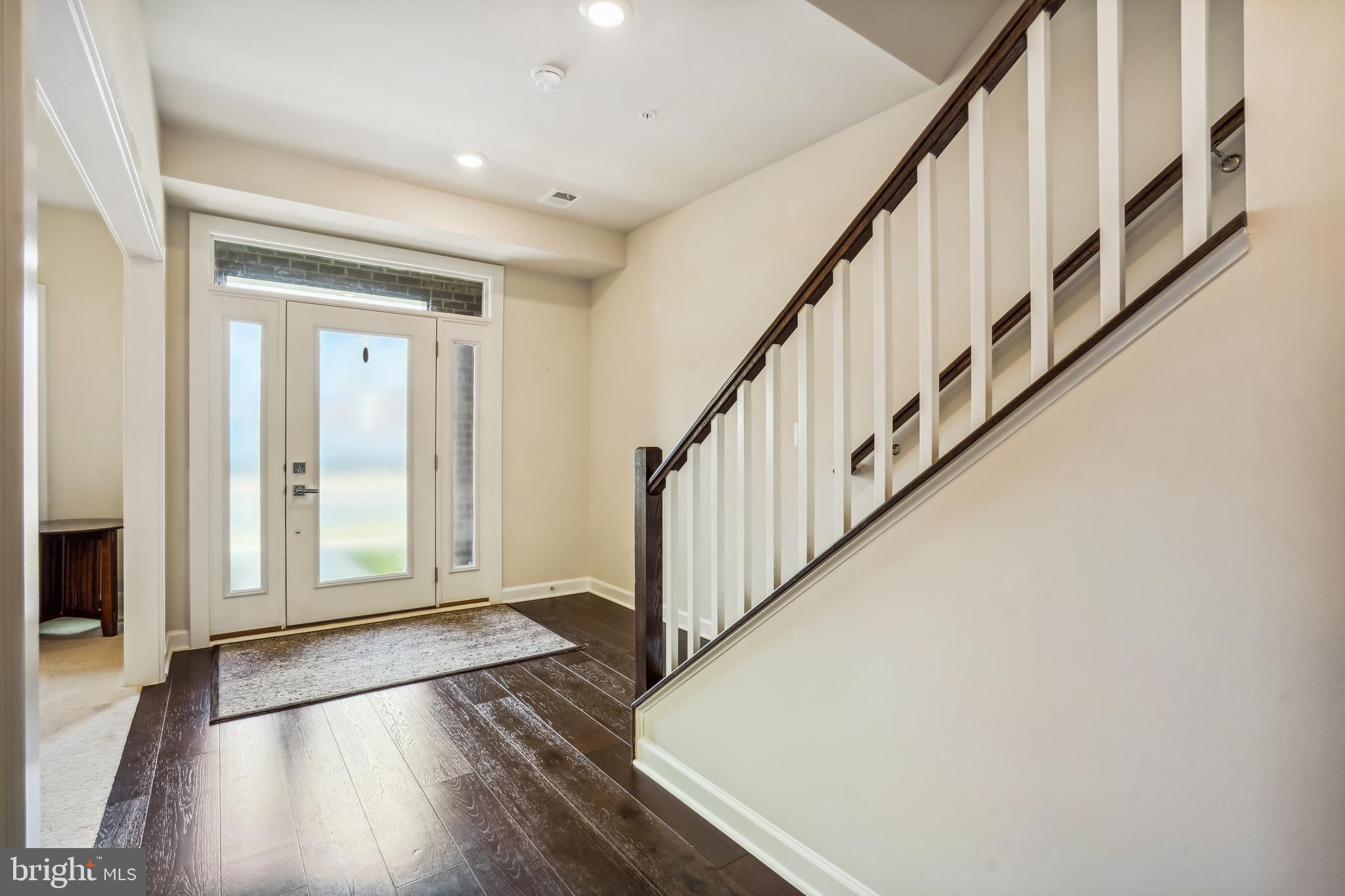 43469 Grandmoore Street Ashburn, VA 20148 - Photo 5 of 62 a view of an entryway with wooden floor
