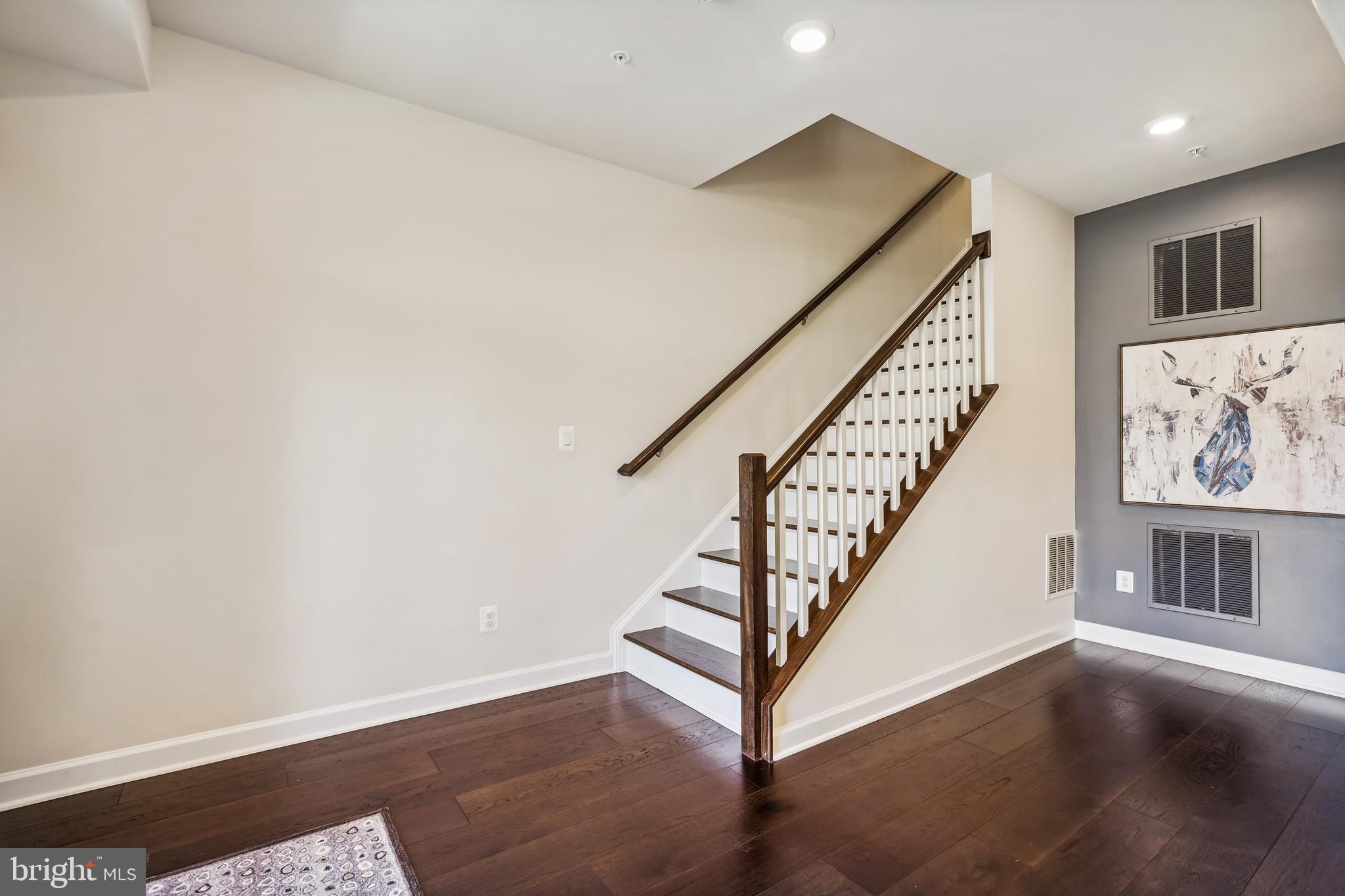 43469 Grandmoore Street Ashburn, VA 20148 - Photo 6 of 62 a view of entryway with stairs and wooden floor