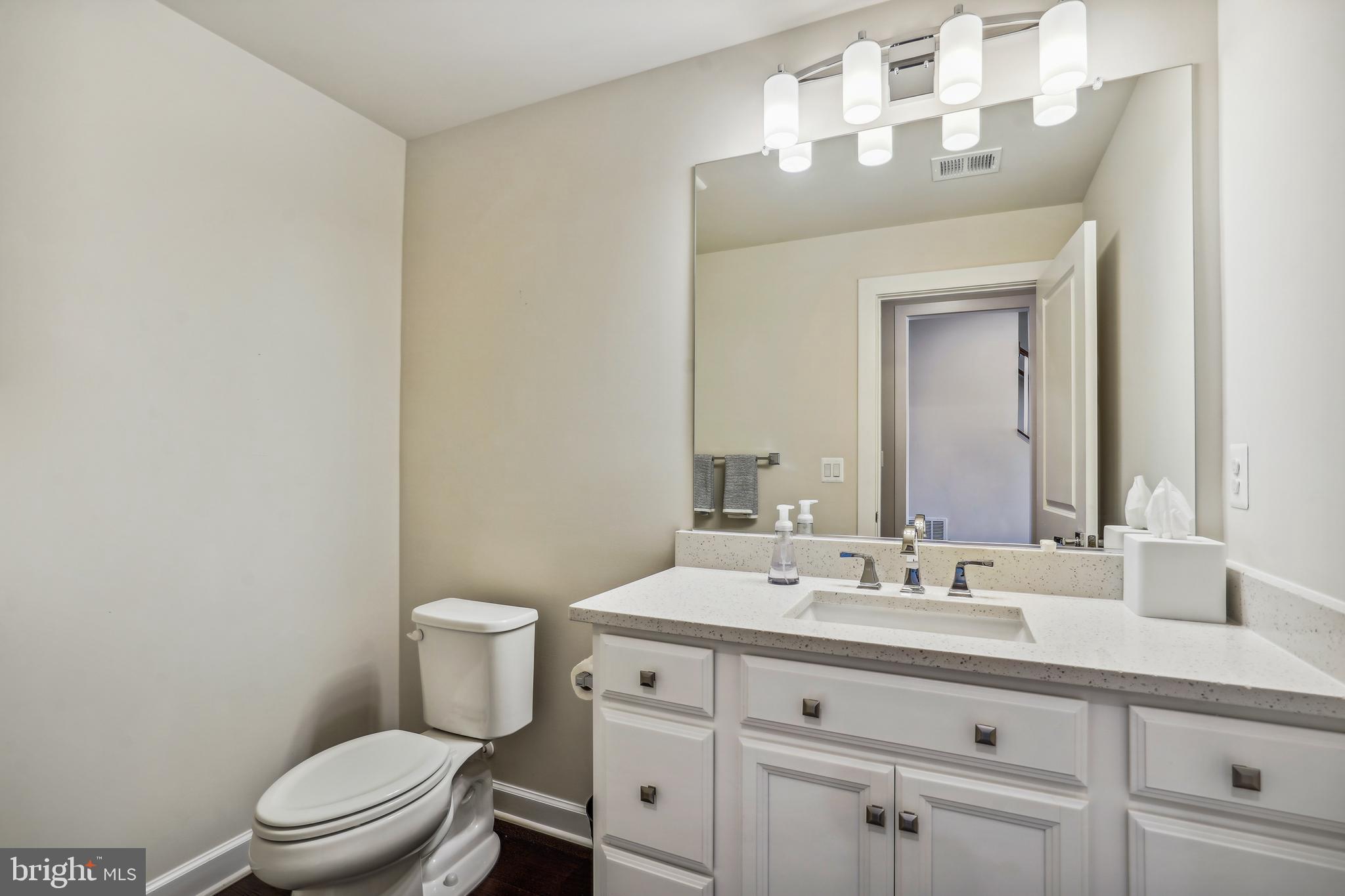 43469 Grandmoore Street Ashburn, VA 20148 - Photo 10 of 62 a bathroom with a sink a toilet and a mirror
