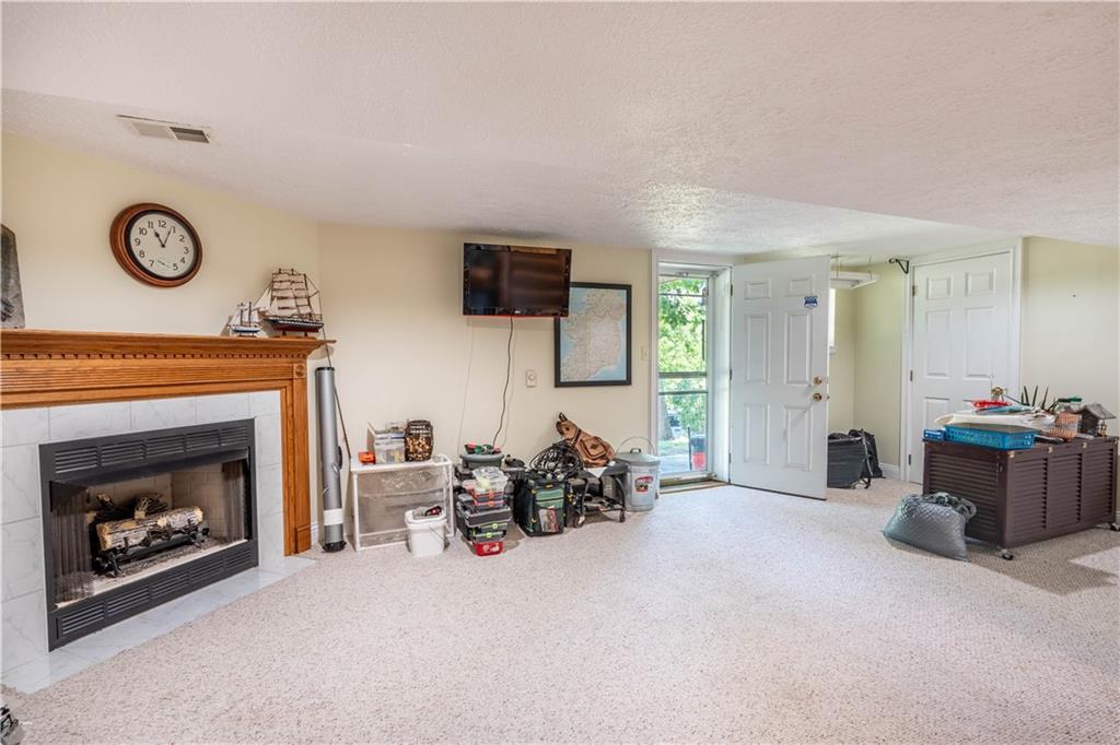 228 Country View Drive Lower Burrell, PA 15068 - Photo 31 of 49 a living room with furniture and a fireplace