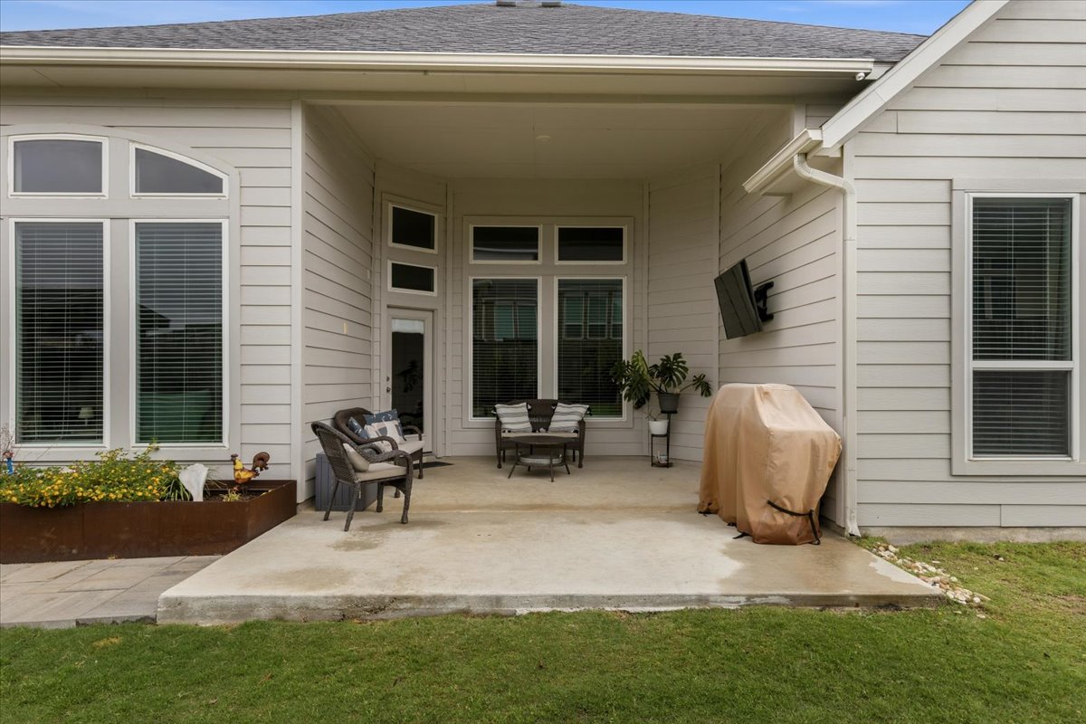 1029 Wild Pecan Loop Buda, TX 78610 - Photo 27 of 37 a view of backyard of house and outdoor seating