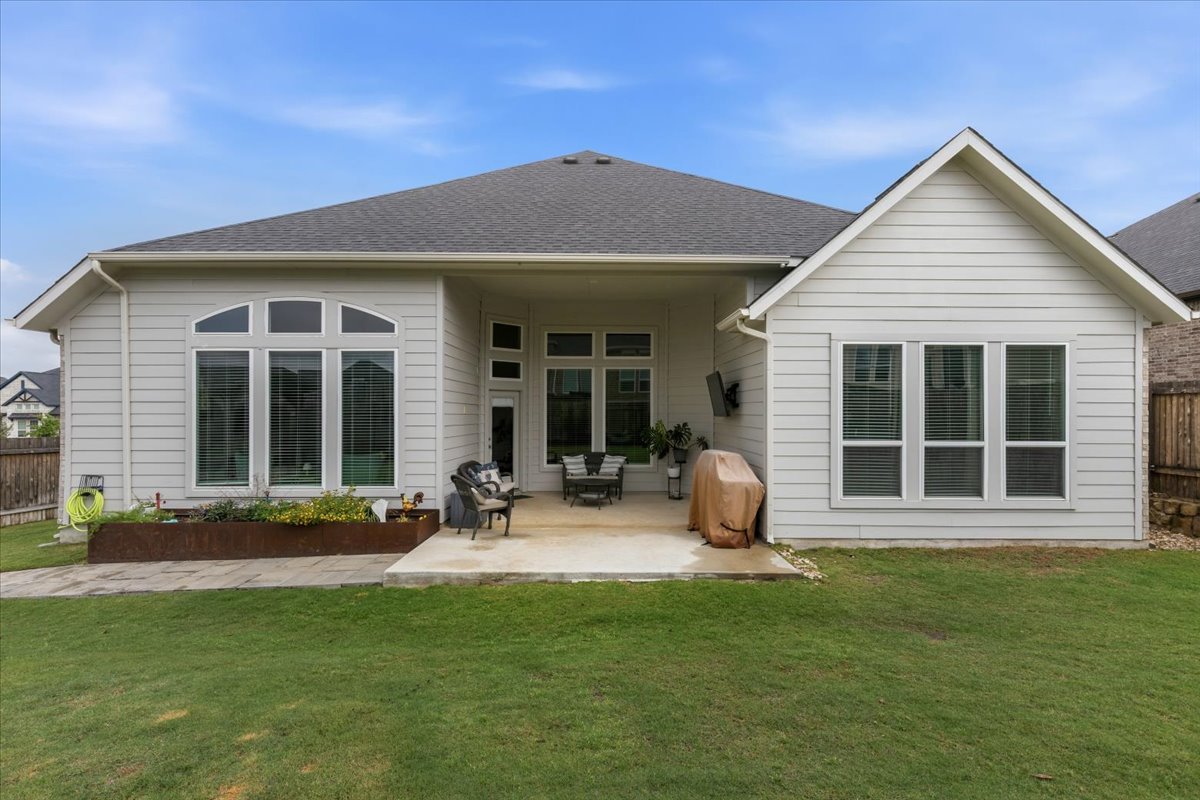 1029 Wild Pecan Loop Buda, TX 78610 - Photo 28 of 37 a front view of a house with yard and seating space