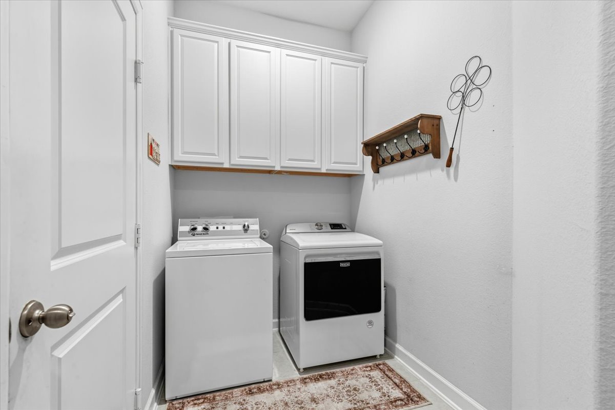 1029 Wild Pecan Loop Buda, TX 78610 - Photo 31 of 37 a utility room with dryer and washer