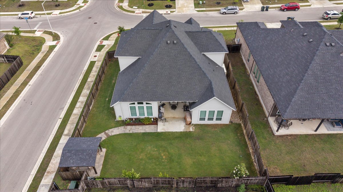 1029 Wild Pecan Loop Buda, TX 78610 - Photo 32 of 37 an aerial view of residential houses with outdoor space